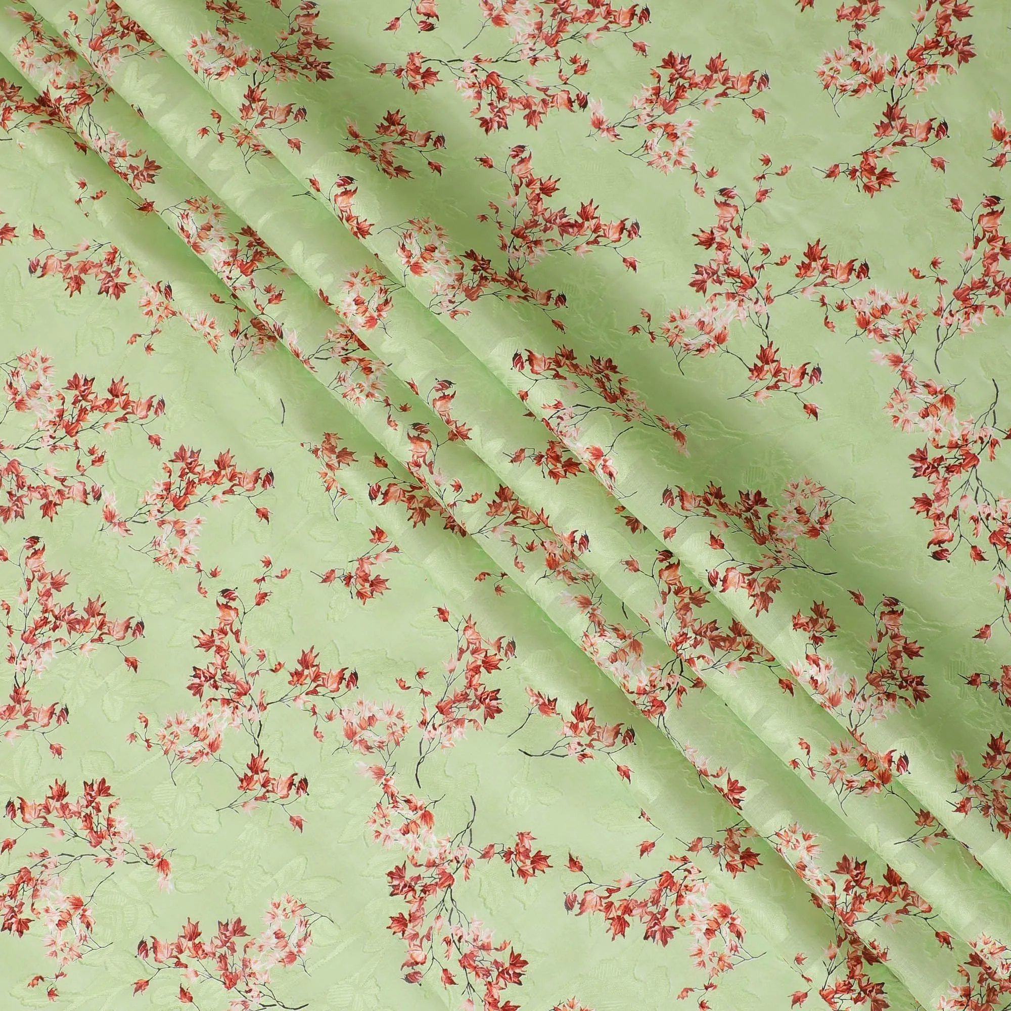 Lime green uragiri cotton voile fabric with same tone jacquard having barn red and black print in floral design-D14325